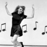 1944: Rita Hayworth (1918 - 1987) dances along an outsize piano keyboard, surrounded by musical notes, in the film 'Cover Girl', directed by Charles Vidor. (Photo by Ned Scott)
